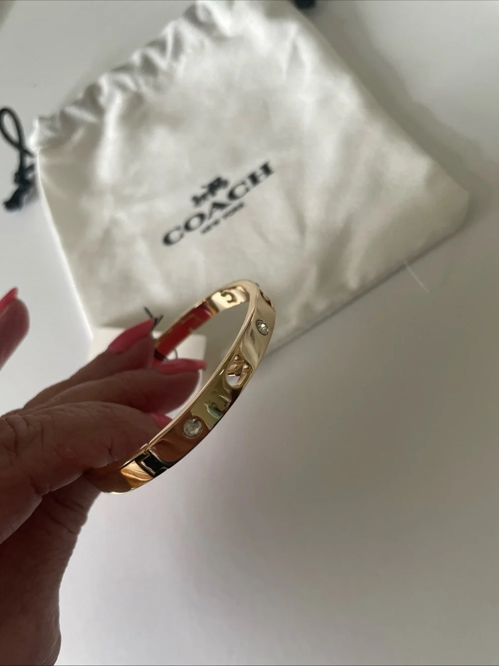 Coach  Gold Tone with crystals Slim Hinged Bangle